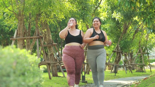 Slow motion. Bride Running outdoor woman. beautiful young chubby overweight woman in sportswear doing exercise outdoors at park. fitness sport club, body and health care. Activity