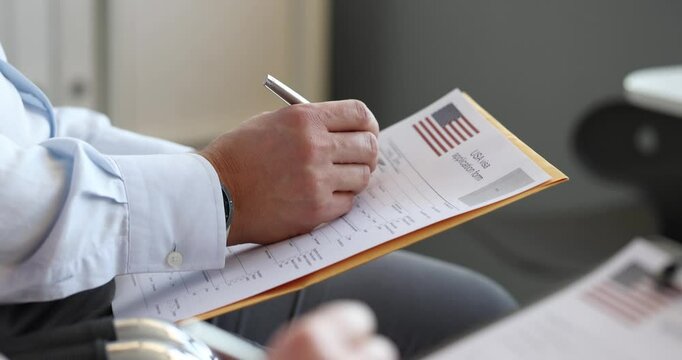 Man fills out USA visa application form. Getting green card usa concept