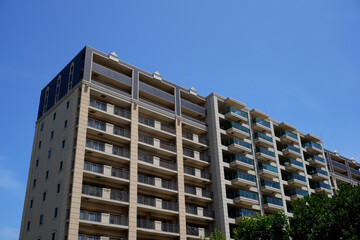 Photographs of apartment(condominium) buildings. The photograph is designed for composition and perspective.