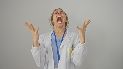 An exasperated female doctor with open mouth and raised hands against a white background.