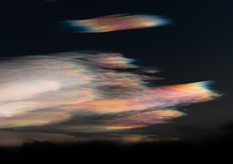 Colorful Polar stratospheric clouds or mother of pearl  shine and illuminates in the stratosphere with deep blue sky as a background