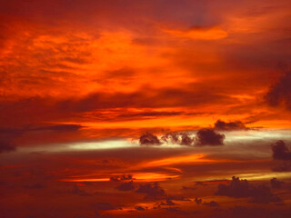 Beautiful sunset on the ocean shore with a view of the islands