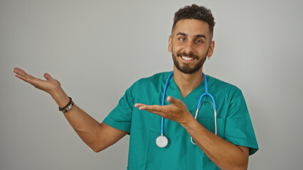 Young hispanic male doctor presenting with a smile over an isolated white background.