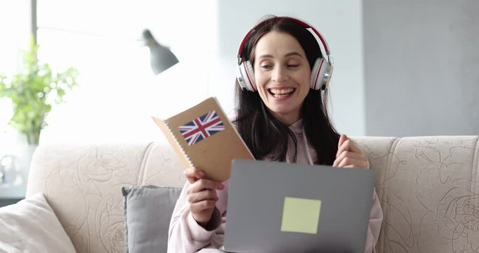 Woman in headphones is studying English remotely in chat. Learning foreign languages with communication with foreigners on internet concept
