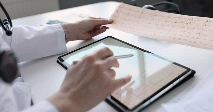 Doctor examines an electrocardiogram of patient after heart attack. ECG diagnostics and health check. Medical examination cardiographer for medical concept.