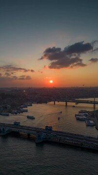 Hyperlapse of an aerial view of the Galata Bridge cityscape at sunset. Cityscape of Istanbul. High-quality shooting in 4K format.