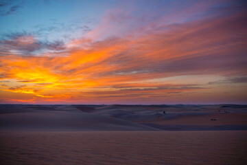 sunset sunrise with beautiful cloud color in the desert sand dune.
