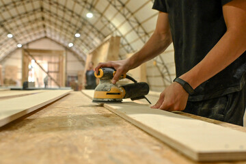 Wood wooden modular houses made of timber yellow board saw processing hands nail grind