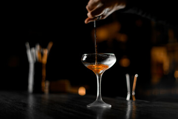 Liquid gold. Bartender's finesse shines in the perfect drink spill.