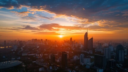 Fototapeta premium Sunset view from a high-rise building capturing city skyline and landmarks.