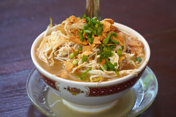 a bowl of soto kudus, a traditional Indonesian vegetable and noodle soup.
