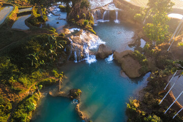 Aerial view of Weekacura Waterfalls at Sunrise, in Sumba, Indonesia