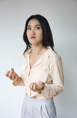 Angry Asian woman with irritating expression, upset unhappy young adult real woman with very angry...
