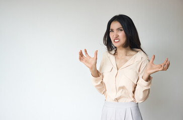 Angry Asian woman with irritating expression, upset unhappy young adult real woman with very angry emotion