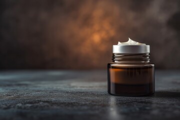 White face and body cream in a glass jar stands on a dark background. Concept of skincare cosmetics for face and body, self-care, banner with copyspace
