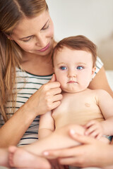 Support, baby and woman in home for love, care and wellness or growth and protection for kid. Development, safety and family or mom in living room with child or toddler, trust and together in morning