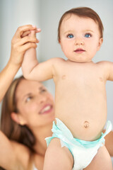 Mother, baby and holding hands with child for learning to walk or taking first step at home. Happy...
