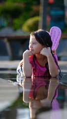 Puddle Perfect : A Little Girl's Pose. Splashing into Summer.
