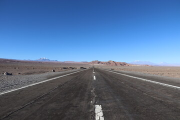 Toconao, Chile. 19-05-2024. Route 23 going south in Chile. A nearly empty road though the desert with a mountainous backdrop.
