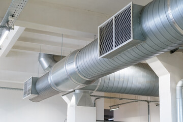Indoor air duct in the factory in the workshop with air holes