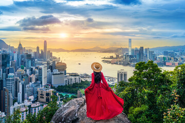 Tourist standing on viewpoint in Hong Kong.