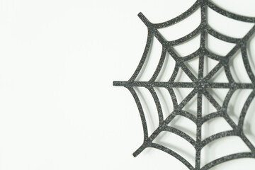 Black web on a white wall, Halloween decoration, autumn time