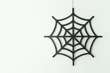 Black web on a white wall, Halloween decoration, autumn time