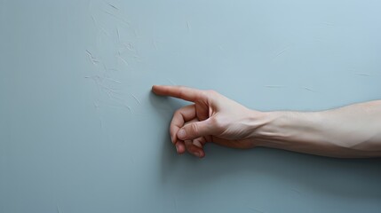 Hand Pointing at Wall