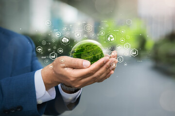 Environmental concept. Green globe in the hands of a businessman with icons. Green future goals, ecology, esg, earth day, forest conservation, CSR, sdgs, Net Zero