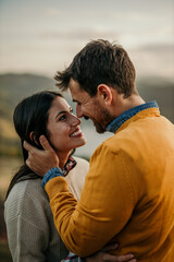 Shot of an affectionate young couple sharing a tender moment at sunset