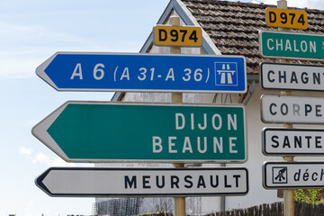 Driving in summer on  road,  signs direction to Dijon, Beaune and other French cities, different types or roads in France, transportation and traffic