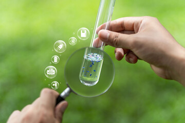 Microplastic waste that contaminates water causes pollution. Microplastics contaminate seawater Repository of water pollution and global warming. A close-up of the debris in a test tube.