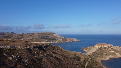 Qarraba Bay flat rock cape Malta, Aerial shot in the morning sunlight. High quality photo