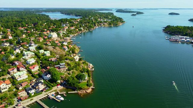 Stockholm archipelago aerial view, baltic sea, Dalar&ouml; island. Summer, swedish typical houses, docks and scenery. boats and sailboats passing by.  