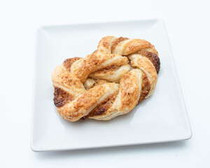 Pigtail bun on a white background