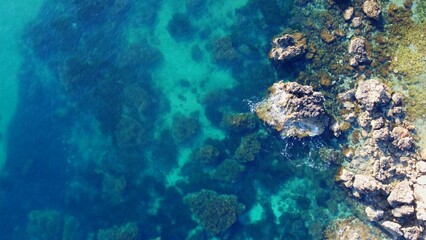 Rocky beach and sapphire sea water on the Maltese island, mediterranean sea, Ghajn Tuffieha bay , Malta. High quality photo