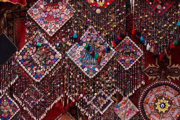 traditional turkish interior with many carpets on the wall