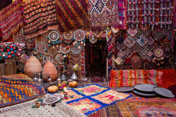 traditional turkish interior with many carpets on the wall