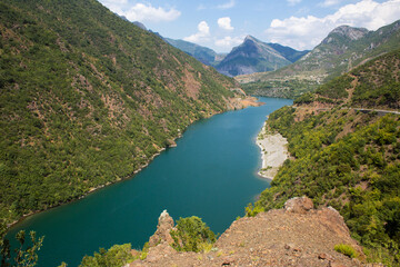 high rocky mountains on the banks of the river