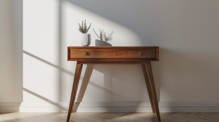 Elegant table with drawer by white wall in room