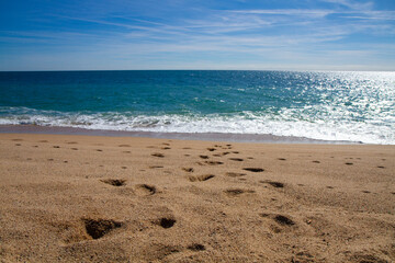 beautiful landscape on the coast of the beach and sea waves against the background of the blue sky