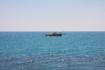 a beautiful ship is sailing in the blue sea