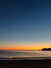 Fototapeta premium beautiful dramatic landscape of sunset on the sea beach