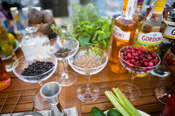 bottles of the famous gin Gordon's on the bartender's table before making cocktails