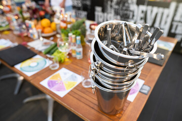 metal ice bucket on bar counter with ice scoop tool