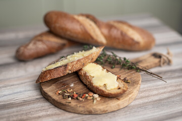 breakfast of sandwich with butter on a wooden board