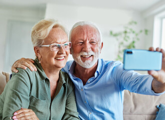 senior woman man couple elderly love elderly selfie camera mobile phone smartphone photo picture portrait male old together active vitality cell phone hug