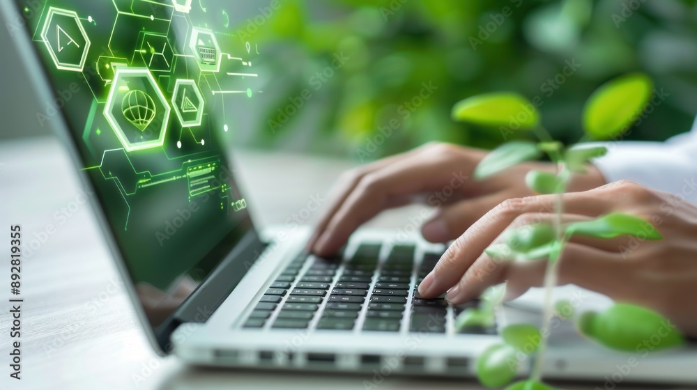 Poster A closeup image of hands typing on a laptop with green digital icons on the screen symbolizing technology and innovation
