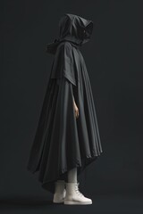 Naklejka premium A person dressed in a black cloak with white sneakers, perfect for a mysterious or dark scene