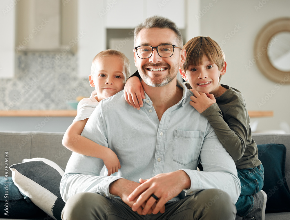 Wall mural Dad, kids and hug on sofa portrait, peace and single parent love for boys in living room. Father, children and embrace for security on couch for care in childhood, relationship and comfortable home